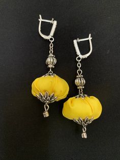 So light and beautiful textile boho earrings. Yellow and silver earrings it's a very unusual colour combination. Could be a great addition to any occasion or celebration or even casual wear. Carefully chosen ingredients made them so attractive and eye catching accessory. All my accessories made in one copy only! Thank you for visiting my little shop and I do hope you could find here what you are looking for. Elegant Handmade Yellow Earrings, Elegant Handmade Summer Flower Earrings, Elegant Yellow Flower Earrings For Summer, Elegant Dangle Flower Earrings For Festivals, Earrings Long Silver, Floral Textile, Handmade Dangle Earrings, Long Silver Earrings, Earrings Handmade Dangle