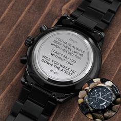 a watch with a poem written on the dial and a photo of rocks around it