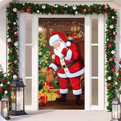 an open door decorated with christmas decorations and santa clause standing in front of a fireplace