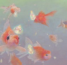 a group of goldfish swimming next to each other on a blue water filled with bubbles