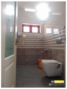 a bathroom with a toilet and shower in it