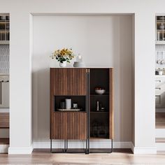 an empty room with a wooden cabinet and shelves on the wall next to a white rug