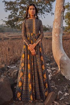 Navy blue maxi dress with ikat printed motifs, mirror embroidered detail.
Component: 1
Printed
Neckline: Round
Sleeve Length: Full
Fabric: Chanderi Silk
Color: Blue
Ikat print
Mirror work - Aza Fashions Kali Anarkali Dress, Spring Maxi Dresses, Maxi Dress Indian, Modern Cape, Cape Set, H Photo, Navy Blue Maxi Dress, For The Culture, Silk Ikat