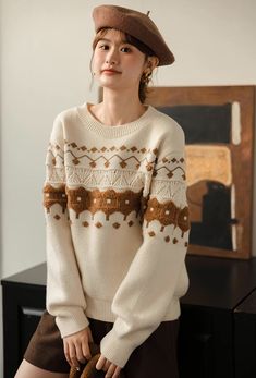 Cozy festive sweater with a round neckline and textured fair isle design. One Size: 45" chest, 22" length Beige Fair Isle Pattern Sweater For Cold Weather, Beige Fair Isle Sweater For Cold Weather, Luxury Brown Fair Isle Pattern Sweater, Brown Fair Isle Knit Sweater, Holiday Fair Isle Crew Neck Sweater, Fair Isle Sweater, Shoe Gifts, Overall Dress, Sweater Blouse