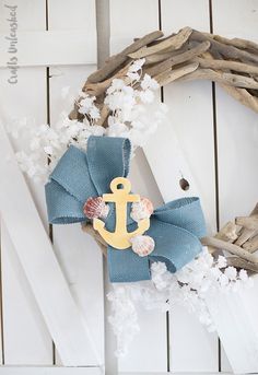 a wreath with an anchor and seashells on it