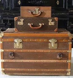 three suitcases stacked on top of each other