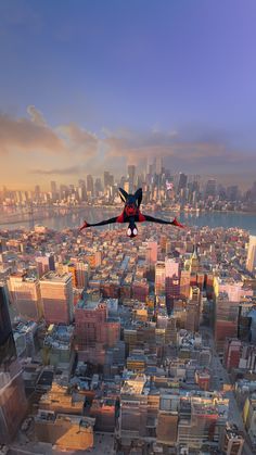 a spider - man flying over the city with his arms outstretched in front of him