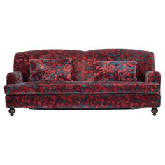 a red and blue couch with pillows on it