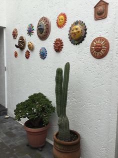 there are many different types of sun and moon decorations on the wall next to each other