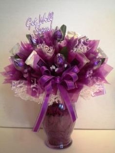 a purple vase filled with lots of candy