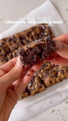 chocolate chip cookie bars are being held up