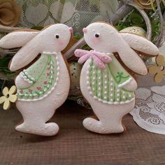 two decorated easter bunnies sitting next to each other