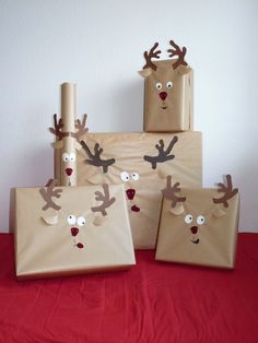 three brown bags with reindeer faces on them