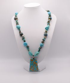 "Necklace with Turquoise, Chalk Turquoise, Smokey Quartz, Magnesite, Ceramic Beads, Focal, mosaic \"turquoise\" (magnesite) (dyed / assembled), blue, 40x29mm-40x30mm top-drilled trapezoid, Antique Silver Plated Toggle, 19.5\"" Turquoise Amazonite Necklace With Natural Stones, Blue Chrysocolla Necklace With Stones, Artisan Turquoise Stones Necklace, Turquoise Polished Chrysocolla Beads Jewelry, Turquoise Chrysocolla Polished Beads Jewelry, Turquoise Chrysocolla Jewelry With Polished Beads, Turquoise Chrysocolla Gemstone Beads Necklace, Turquoise Chrysocolla Gemstone Necklace, Bohemian Turquoise Howlite Beaded Necklace