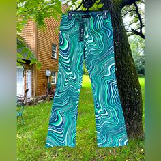 These Brand New Coban Trousers Are The Statement Piece Your Wardrobe Needs. Featuring A Low Rise Fit With Flared Leg In A Green 70’s Ripple Print. Size Small Fabric Content: 95% Cotton 5% Elastane Size Guide Is Pictured Retro Fitted Pants For Festival, Retro Festival Fitted Pants, Fitted Bottoms With Retro Print In Groovy Style, Fitted Retro Print Groovy Bottoms, 90s Style Fitted Green Bottoms, Fitted 70s Inspired Summer Pants, Fitted Pants With Retro Print For Spring, 90s Style Fitted Summer Pants, 90s Style Fitted Pants For Summer