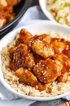 chicken and sesame seed rice in a white bowl