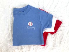 This custom embroidered Toddler short sleeve shirt is a sweet casual style perfect for fall, summer, and all Spring long! Choose from a wide array of embroidery options, from construction trucks to baseballs, and more! Gift this for a second birthday, third birthday, and so on! Inspired by my own love of embroidery for my sweet babe- You'll love this sweet and Personalized Embroidered Shirt for your little one.  Customs available, contact us! Hand Embroidery Boys Clothes, Cute T-shirt With Machine Embroidery And Short Sleeves, Cute Machine Embroidered Short Sleeve T-shirt, Custom Embroidered Short Sleeve Shirt For Summer, Short Sleeve Cotton Top With Machine Embroidery, Cotton Top With Machine Embroidery, Short Sleeve, Customizable Red Short Sleeve Tops, Cute Short Sleeve Tops With Custom Embroidery, Cute Short Sleeve Tops With Machine Embroidery