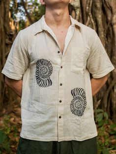 Rock a timeless, bohemian look with our Fossil shirt. Made of airy cotton, this sustainable fabric features a hand block print of a fossil on the front and back, giving it a unique, earthy vibe. Perfect for the free-spirited fashionista. Trippy Shirts, Bohemian Shirt, Stylish Shirts Men, Mens Dress Shirts, Sustainable Fabric, Bohemian Look, Unique Shirt, Mens Dress, Aloha Shirt