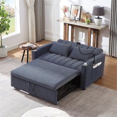 a living room with a blue couch and coffee table