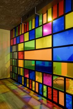 a room that has many different colored squares on the wall