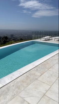 an empty swimming pool on top of a building