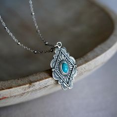 The perfect everyday accessory, this sterling silver necklace features handmade pendent with genuine turquoise on an adjustable delicate ball chain. Tia Turquoise and Sterling Silver Necklace Adjustable 16-18" MADE IN USA Native American Western, قلادات متدلية, American Western, Estilo Boho Chic, Mens Jewelry Necklace, Medallion Necklace, Flower Pendant Necklace, Jewelry Sterling Silver, Western Jewelry