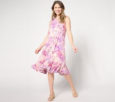 Who's that lovely lady? Everyone will be asking as you whoosh by in this ruffled tank dress. The perfect complement to your summer social scene, this party-ready piece is a carefree confident look that won't go unnoticed. From LOGO by Lori Goldstein®. Sleeveless Ruffled Dress For Summer Garden Party, Summer Sleeveless Ruffled Dress For Garden Party, Knee-length Sleeveless Dress With Ruffle Hem For Spring, Spring Beach Sleeveless Dress With Ruffle Hem, Spring Sleeveless Dress With Ruffle Hem For Beach, Flirty Sleeveless Midi Dress For Summer, Flirty Sleeveless Summer Midi Dress, Flirty Sleeveless Ruffled Dress For Summer, Flirty Ruffled Sleeveless Summer Dress