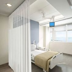 a hospital room with a bed and medical equipment