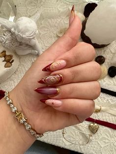 Dark Red With Gold Nails, Red Wine And Gold Nails, Red Nails With Gold Details, Red Ethereal Nails, New Years Nail Designs Red, Red Nails With Gold Chrome, Wine Red Nails Aesthetic, Christmas Red And Gold Nails, Wine Red Nails With Gold