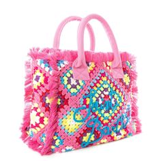 a pink handbag with multicolored sequins on it