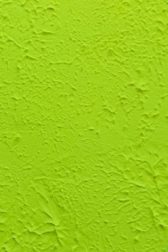 an image of a bright green wall that looks like it has been painted with paint