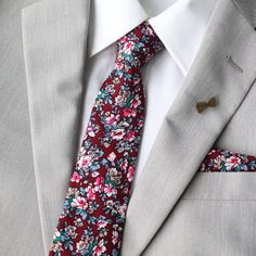 An upbeat floral pattern adds an instant lightheartedness to any event, and our bow tie is guaranteed to liven up your look. Tie Mood adult and kids bow ties are double-deck (two layers), have a sturdy loop and clasp to ensure a snug and comfortable fit.    Matches closely to Birdy Grey's Cabernet  Matches closely to Jenny Yoo's Dark Berry  Matches closely to Bill Levkoff's Wine  Matches closely to David's Bridal Wine  Matches closely to Azazie's Cabernet Adult Skinny Necktie:  approx. 2.5 inche Floral Print Standard Tie For Wedding, Wedding Suit Accessories With Floral Print Standard Tie, Spring Wedding Suit And Tie Accessories, Floral Print, Spring Wedding Floral Print Suit And Tie Accessories, Dapper Suit And Tie Accessories For Spring Wedding, Floral Print Tie For Groom, Floral Print Ties For Groom, Floral Print Standard Tie For Groom, Floral Print Ties For The Groom