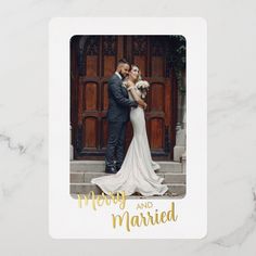 a wedding photo with the words merry and married in gold foil on top of it