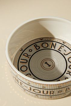 a white bowl sitting on top of a table