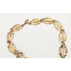 This is part of Chairish’s Costume Jewelry assortment.  1950s lightweight goldtone leaves link necklace with hook clasp. Marked "Napier" on the hook. Measures:  6 3/4 inches long by 6 1/4 inches wide. Largest interior circumference approximately 18 3/4 inches. Excellent condition. Mid-century Gold Brass Jewelry, Vintage Gold Leaf Jewelry, Vintage Gold Leaf-shaped Jewelry, Leaves Necklace, The Hook, Hook Clasp, Leaf Necklace, Link Necklace, Vintage 1950s