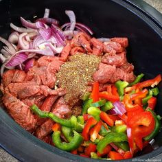 the meat and vegetables are mixed together in a bowl