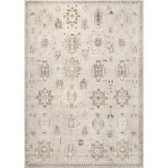 an area rug with various designs and colors on the floor, including beiges and browns