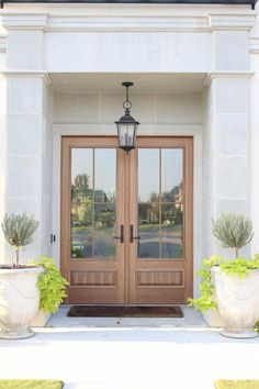 two planters on either side of the front door