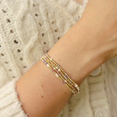 We added a pop of color to my Classic gold bead bracelet and it is the perfect addition to a dainty stack. The beads are strung on a premium stretch cord.SOLD BY ONE BRACELET or Set of fourITEMS DETAILS:Water Resistant -Nickel-free - Allergy-free- 18K gold plated brass beads made to last- round bead size: 2mm- Glass seed beads 2mm- stretchy elastic cord, no clasp, designed to fit wrist sizes from 6 - 7 inches Wrist Stretches, Gold Bead Bracelet, Gold Bracelet Simple, Miyuki Bracelet, Green Shades, Brass Beads, Bead Ideas, Gold Bead Bracelets, Beaded Cuff