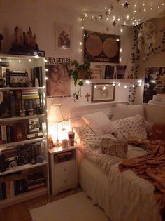 a bedroom with lots of lights and pictures on the wall