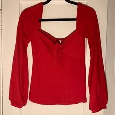 Red, Tie Top, Wide Sleeve Knit Top. Never Worn. Red V-neck Top From Urban Outfitters, Casual Red Stretch Sweater, Urban Outfitters Red Tops For Winter, Red Urban Outfitters Tops For Winter, Urban Outfitters Red Winter Tops, Red Long Sleeve Top From Urban Outfitters, Urban Outfitters Red Long Sleeve Top, Long Sleeve Knit Top, Red Tie