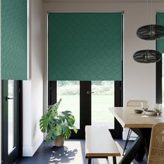 a dining room with green roller shades on the windows and table in front of it