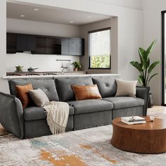 a living room filled with furniture and a large window