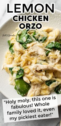 a white plate topped with pasta and spinach