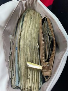 an open purse filled with lots of papers