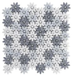 a white and gray flower pattern is shown on the wall in front of a white background