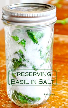 a mason jar filled with basil and salt