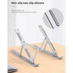 the adjustable laptop stand is on top of a wooden table