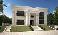 a large white house with columns on the front and stairs leading up to it's entrance