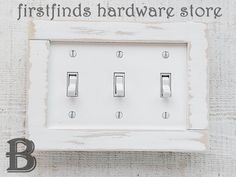 a white light switch cover with the words firsthand hardware store on it